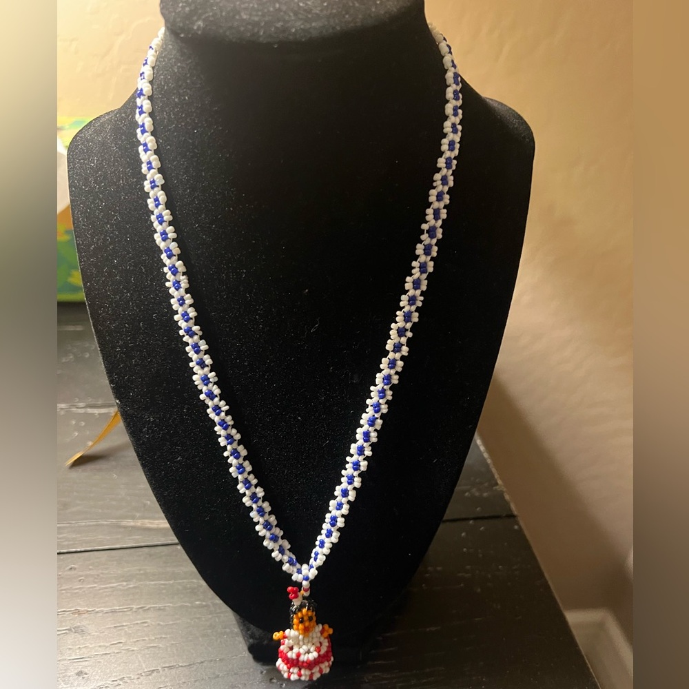 Elegant Blue and White Necklace with Intricate Pendant